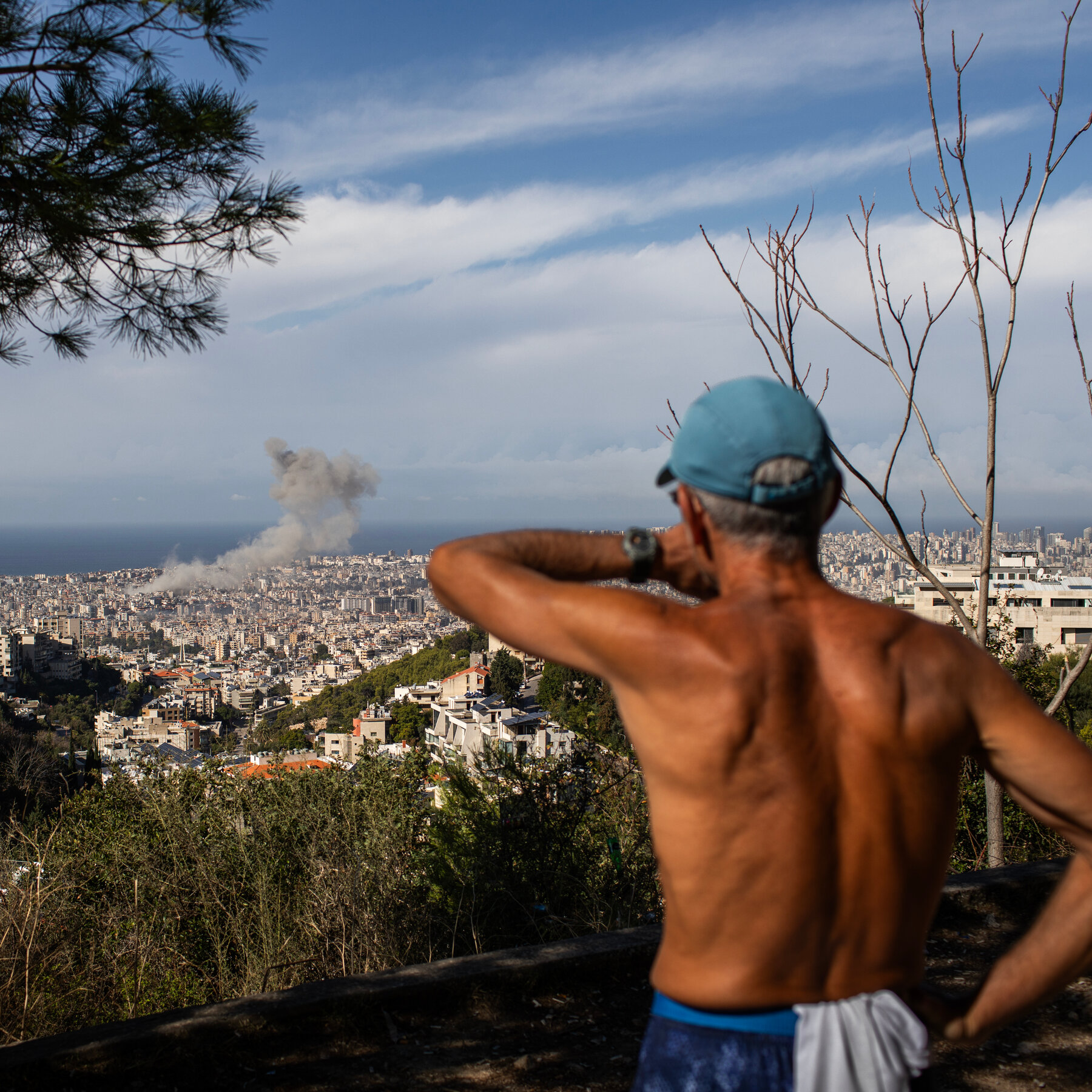 Crowds Watch Israeli Airstrikes from a Beirut Hillside